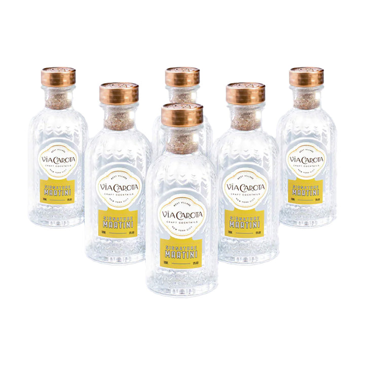 Set of six Via Carcica Classic Martini bottles with gold caps on a white background